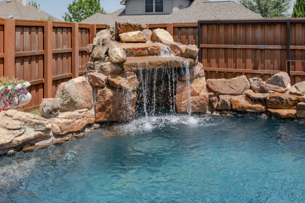 Close-up of waterfall flowing into a pool with natural stone features