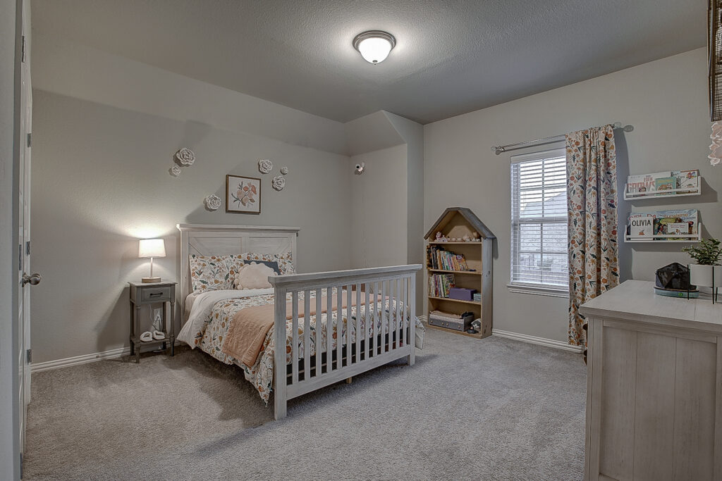 Cozy child's bedroom with floral bedding and reading nook