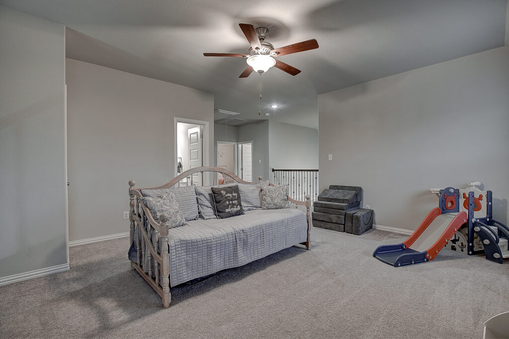 Game room angle showing entrance to hallway and daybed