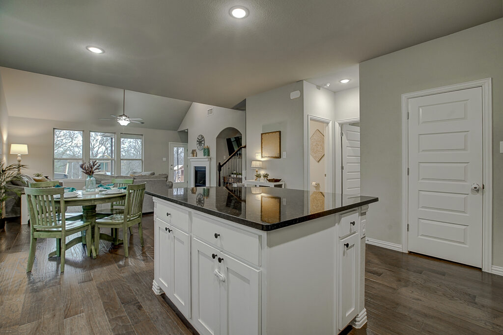 Kitchen island view into living and dining space