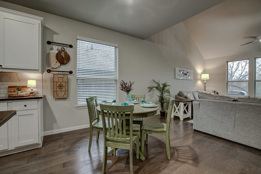 Dining nook with wood table and window light