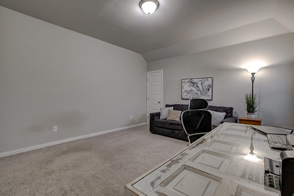 Oversized bedroom with desk and built-in shelves