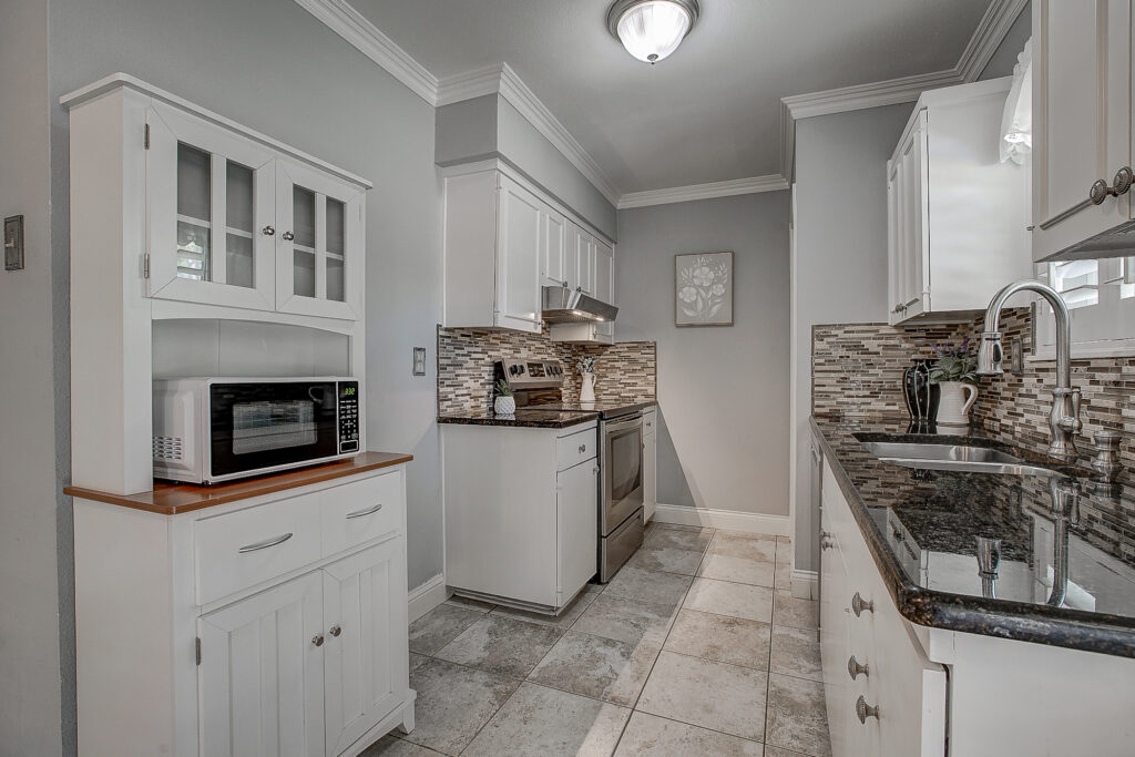 Kitchen at 5302 Saddleback Rd Garland TX with stainless steel appliances, tile flooring, and cabinetry